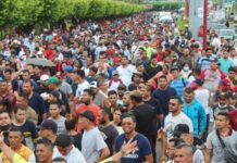 Migrants march through southern Mexico, denouncing delays and demanding work permits